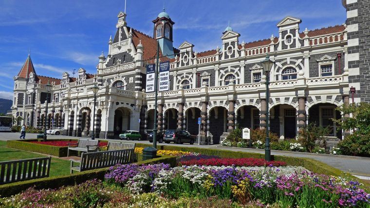 Dunedin Railway Station behind its flower gardens