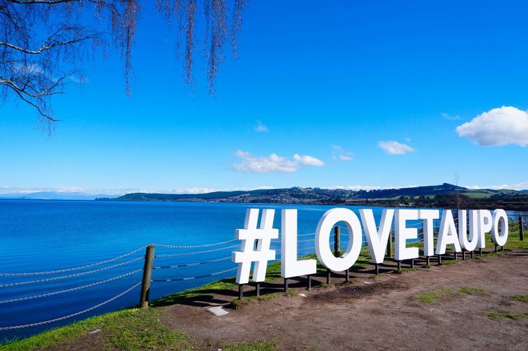 The Love Taupō sign beside Lake Taupō