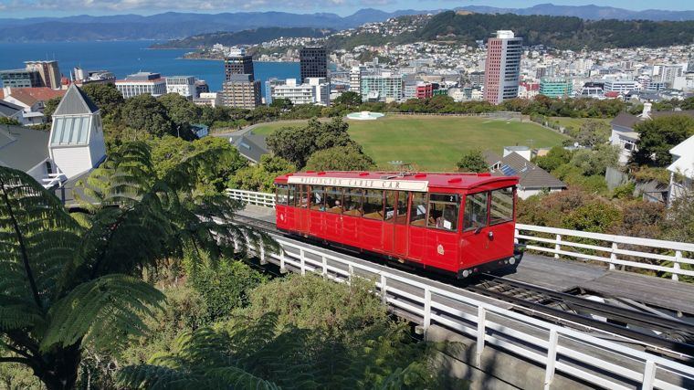 The red Wellington Cable Car above the city